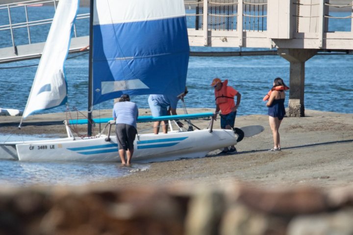 a group of people on a boat in the water