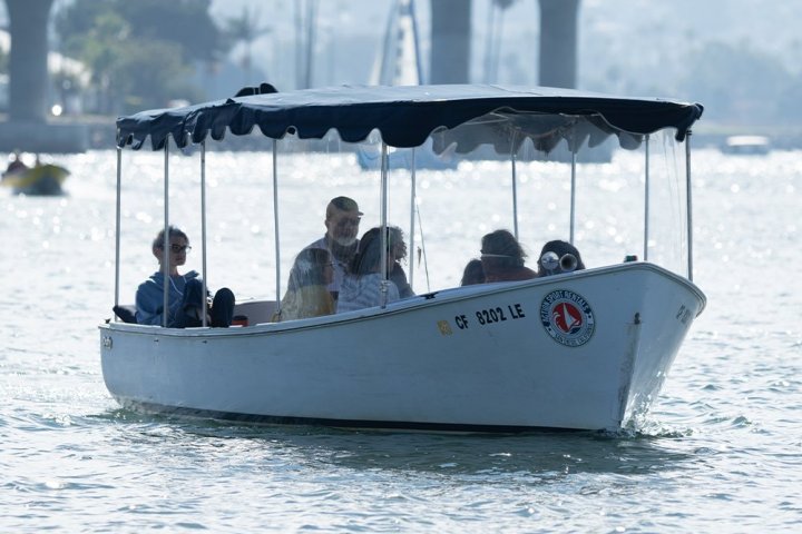 a group of people on a boat in the water