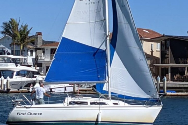 a boat is docked next to a body of water