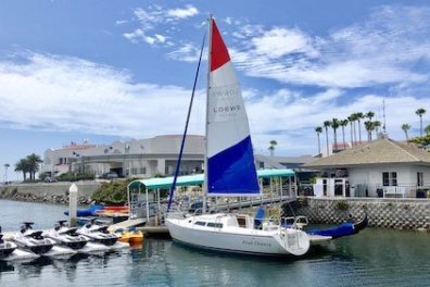 a boat is docked next to a body of water