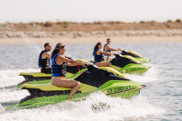 a person riding a wave on a surf board on a body of water