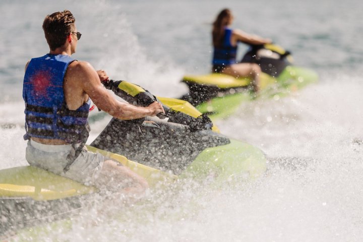 a man riding a wave on a surfboard in the water
