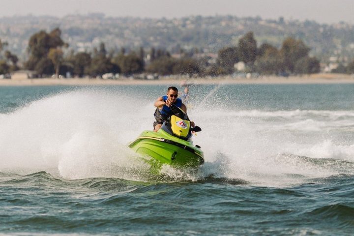 a man riding a wave on top of a body of water