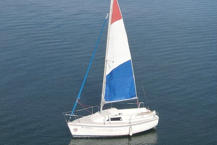 a small boat in a large body of water