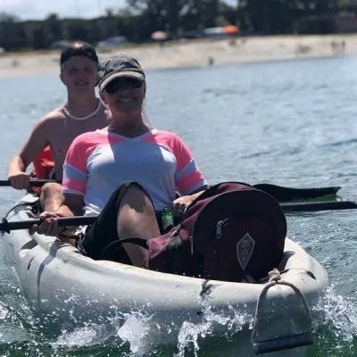 a person rowing a boat in a body of water