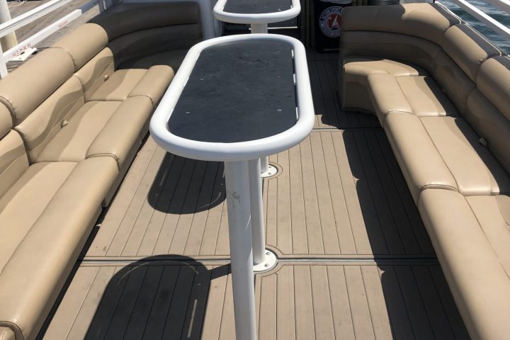 a boat sitting on top of a car