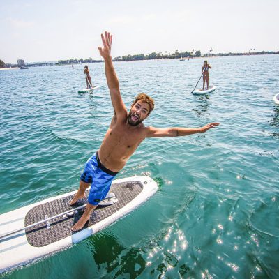 a person riding a surf board on a body of water