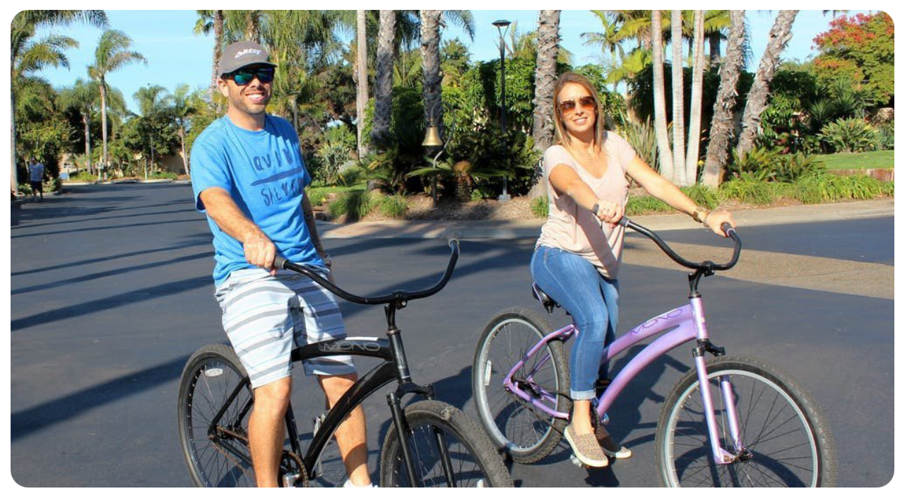 a person riding on the back of a bicycle